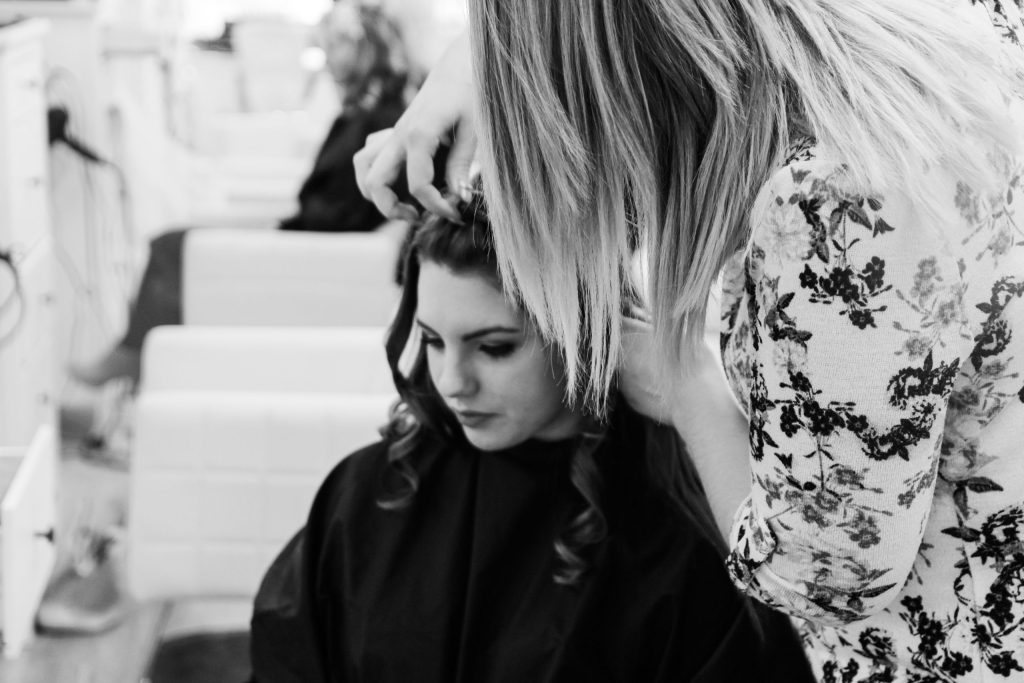 hairstylist doing brides hair