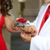 Boy giving his date a corsage for homecoming