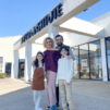 Aveda graduate Laura Tamez posed with husband and children